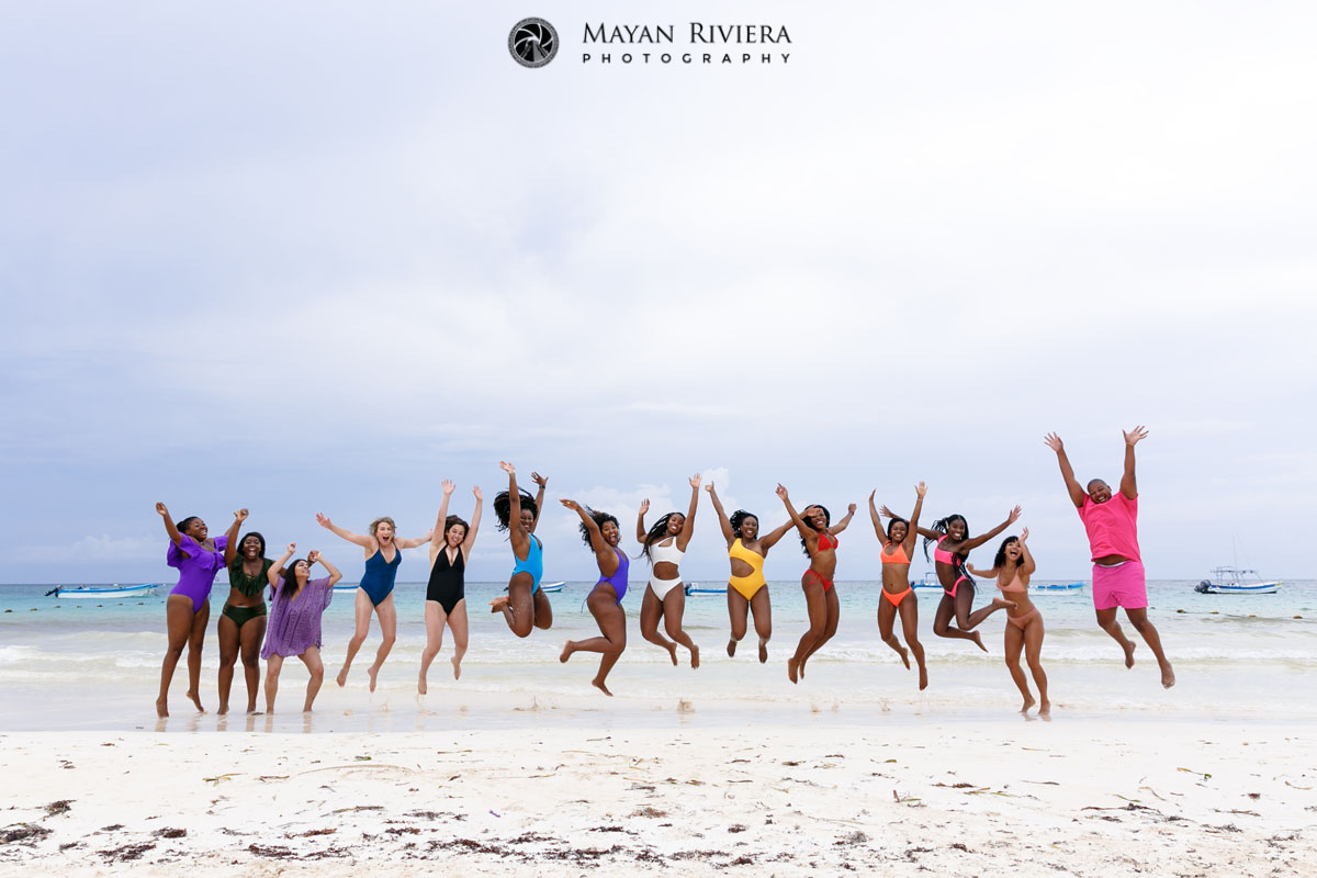 EntourageOfBestiesJumpForJoyOnBeach