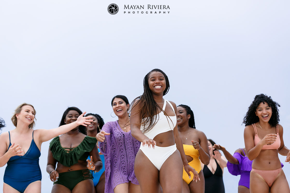 SmilingBrideWithEntourageAtHerBack