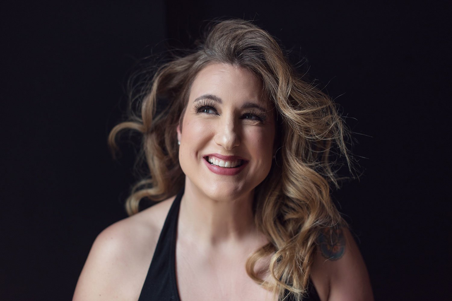 Smiling lady in boudoir session