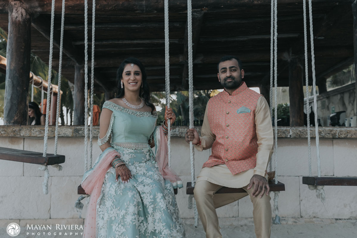 HinduWeddingCoupleSitsOnSwings
