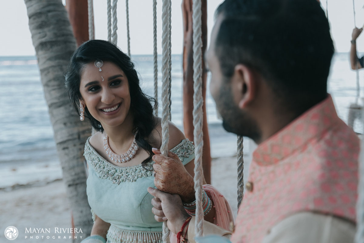 HinduWeddingCoupleSitsOnSwings