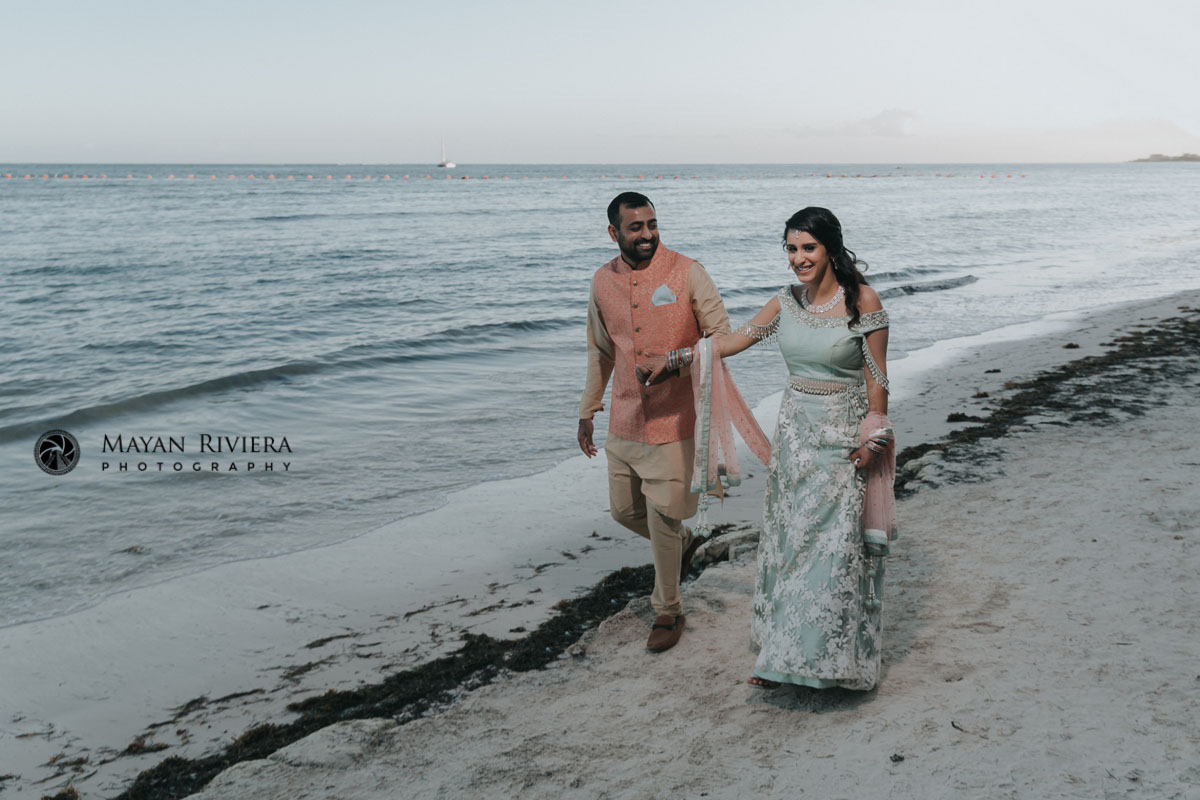HinduWeddingCoupleHoldingHandsOnBeachWalk