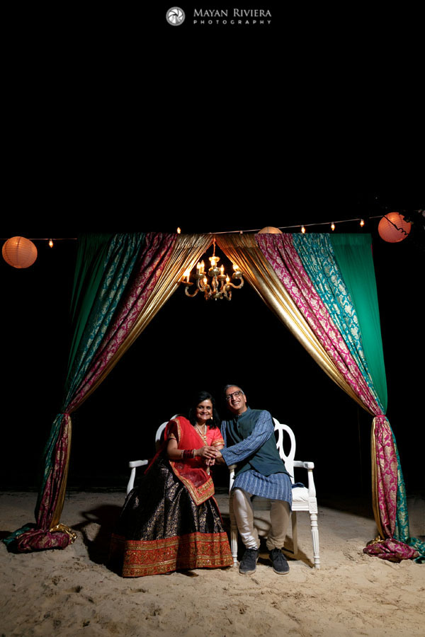 HinduCouplePosesUnderCurtainArch