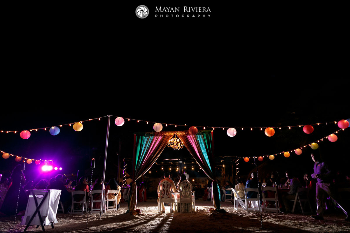 HinduWeddingCouplePosesUnderCurtainArch