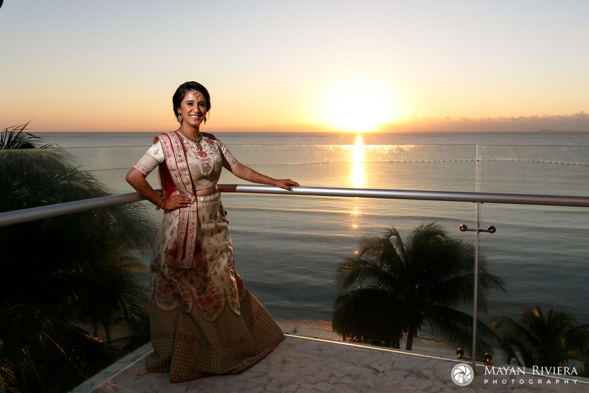 HinduBridesStandsOnBalconyAtSunrise