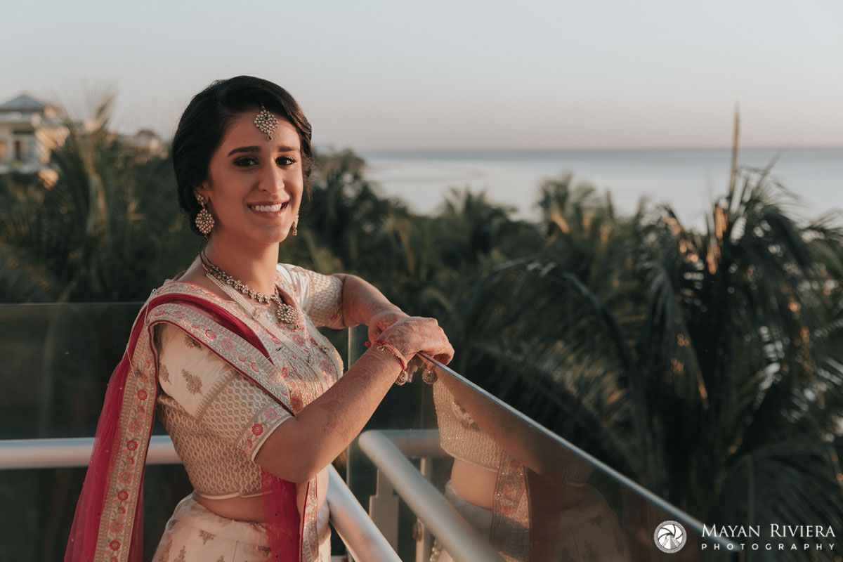 HinduBridesStandsOnBalconyAtSunrise