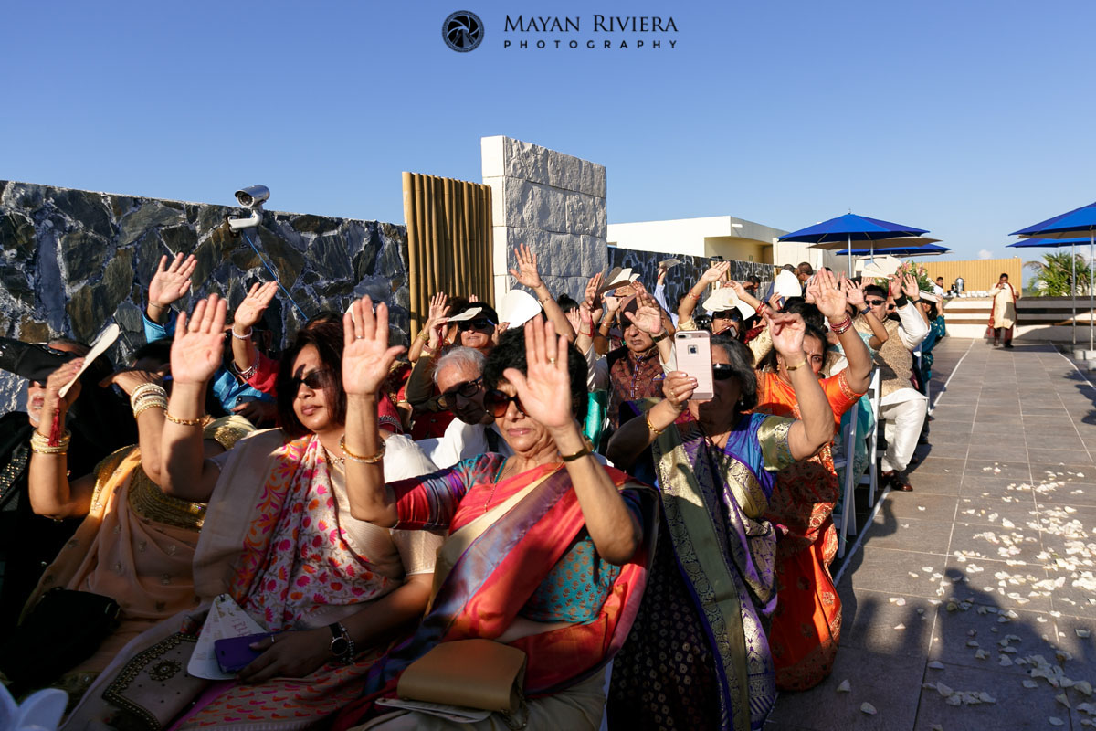 HinduWeddingGuestsRaiseHands
