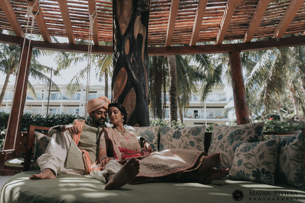 HinduNewlywedsPoseOnPalapaBed