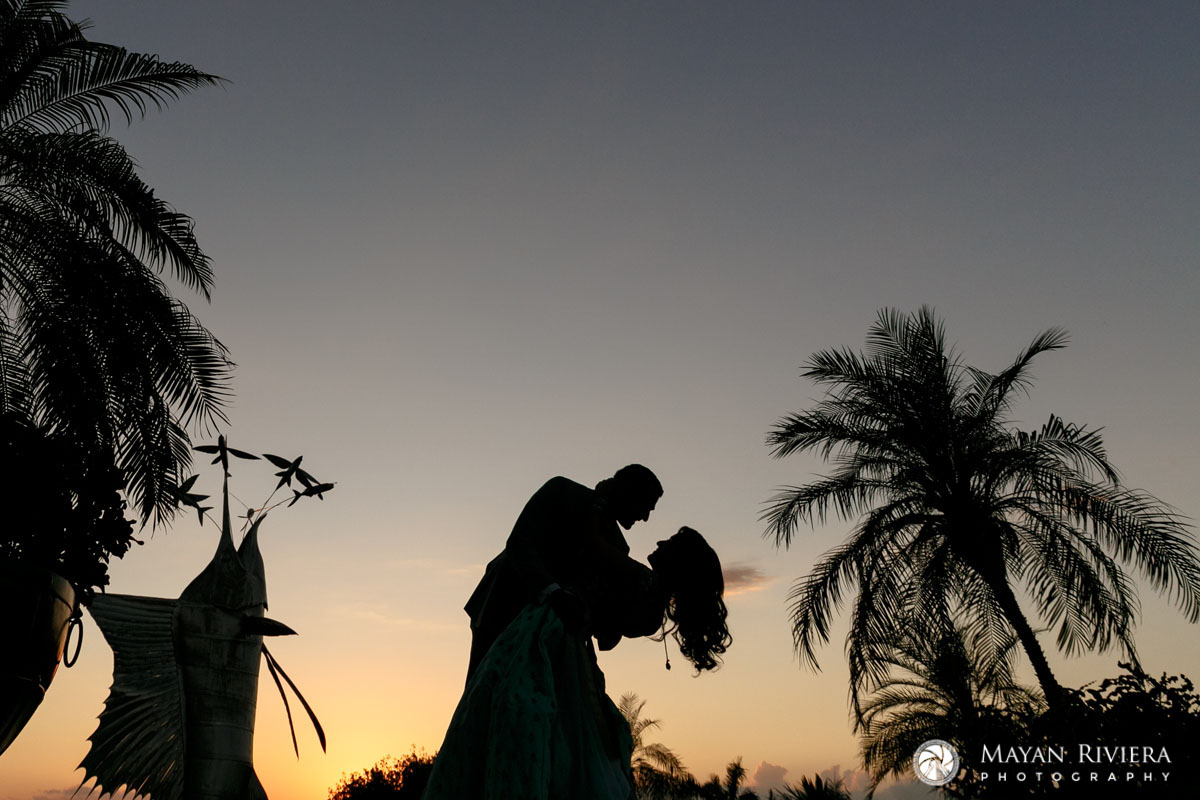 HinduNewlywedsDipInSunsetShilouette
