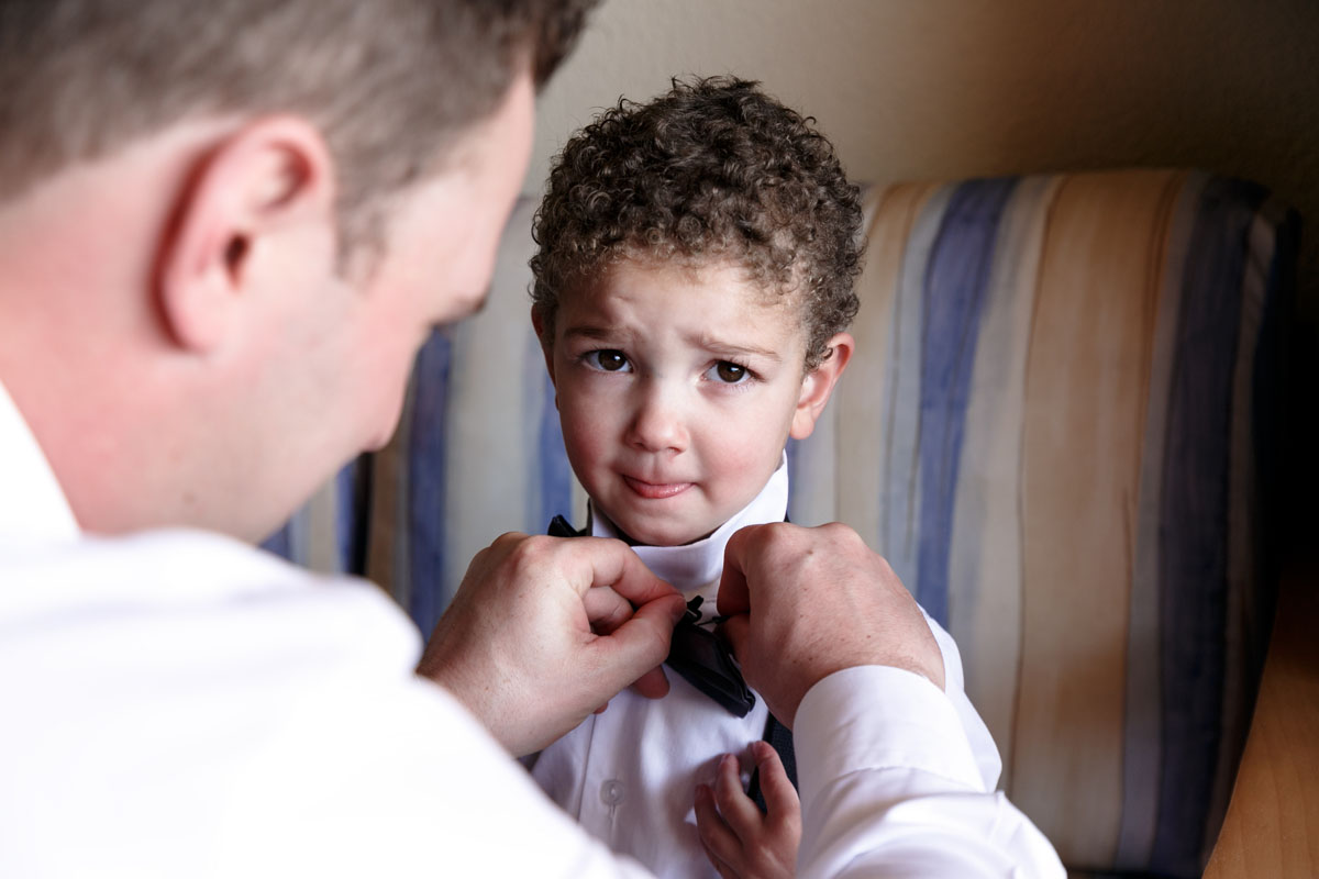 BarceloGroomHelpingRingBearerGettingReady