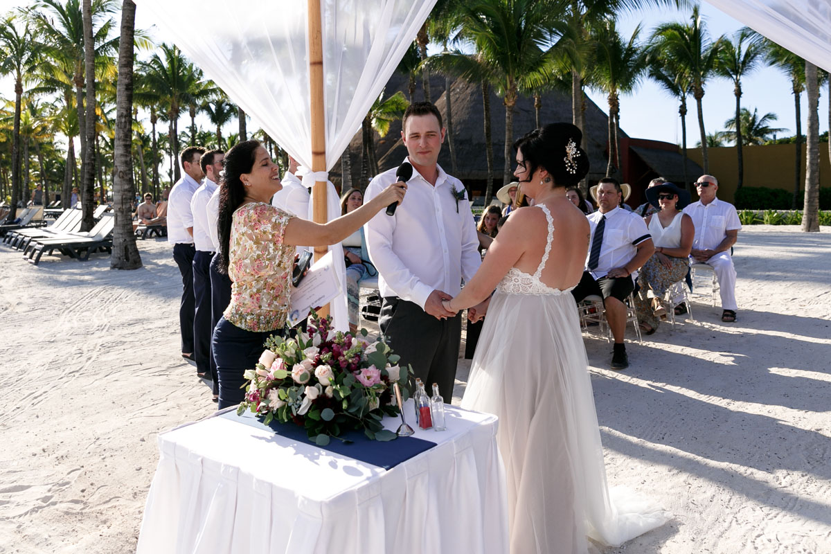 BarceloWeddingCoupleHoldHandsAtCeremony