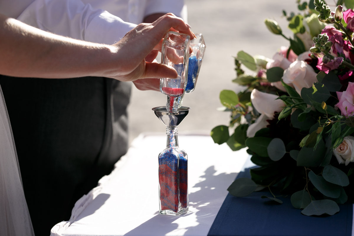 BarceloWeddingCouplePoursSandCeremony