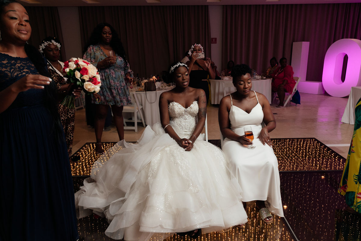 NewlywedsSeatedOnDanceFloor