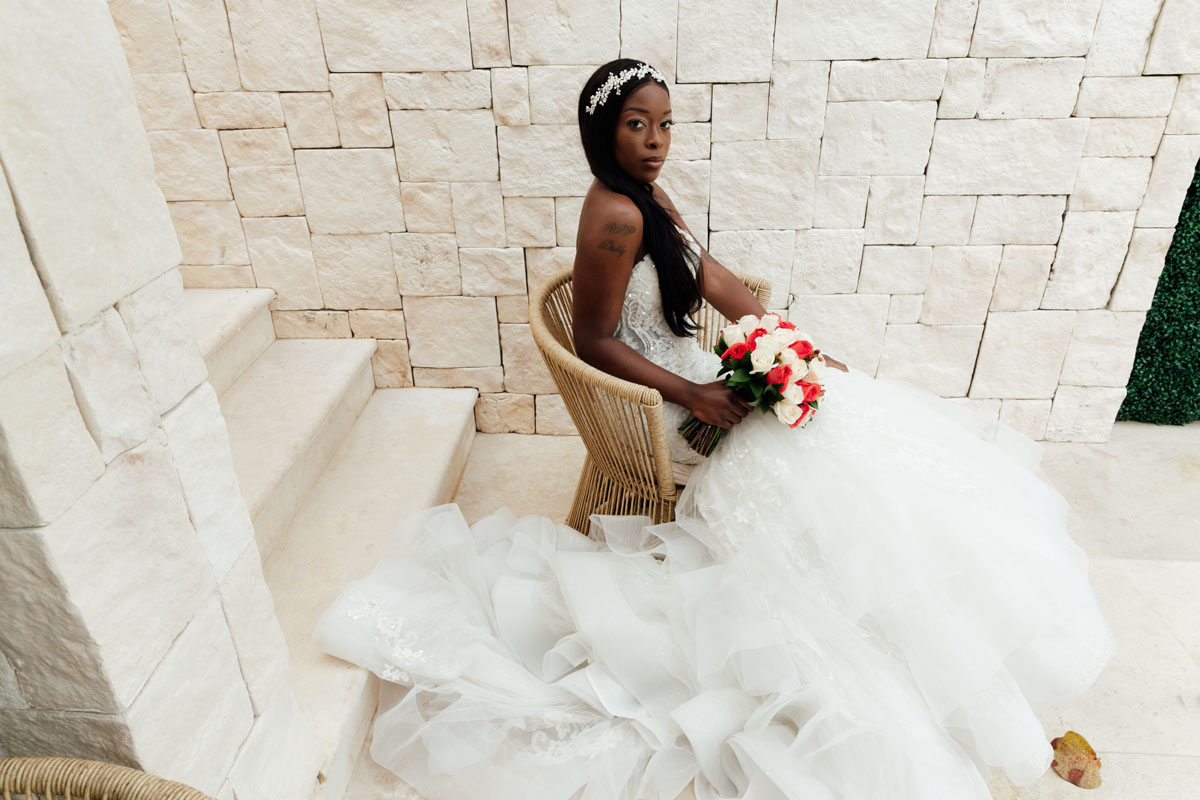 PlayaMujeresBrideSitsByStaircase