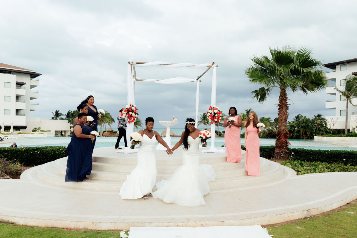 NewlywedsWalkOutHoldingHands