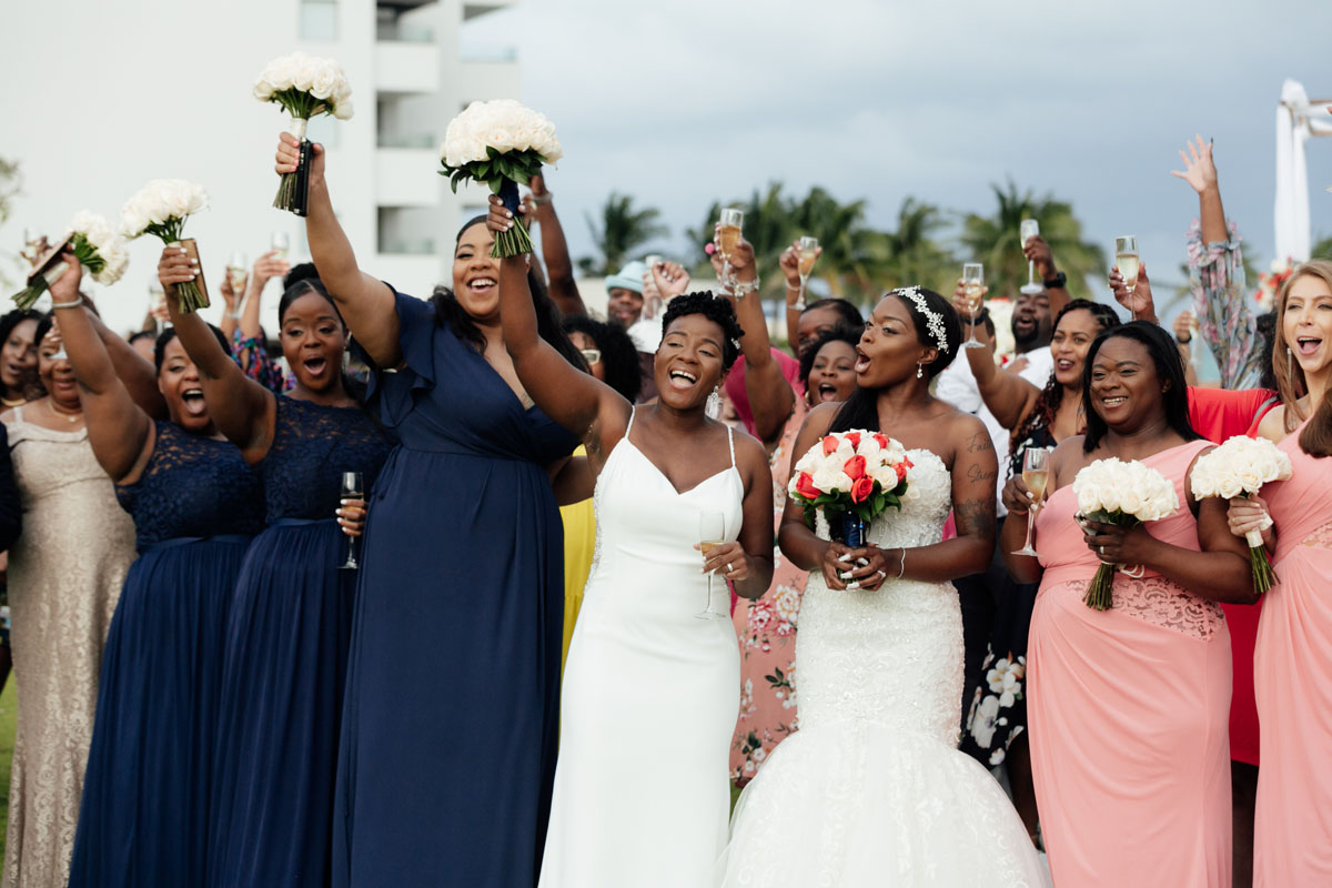 WeddingPartyAndGuestsCheerInDroneShot