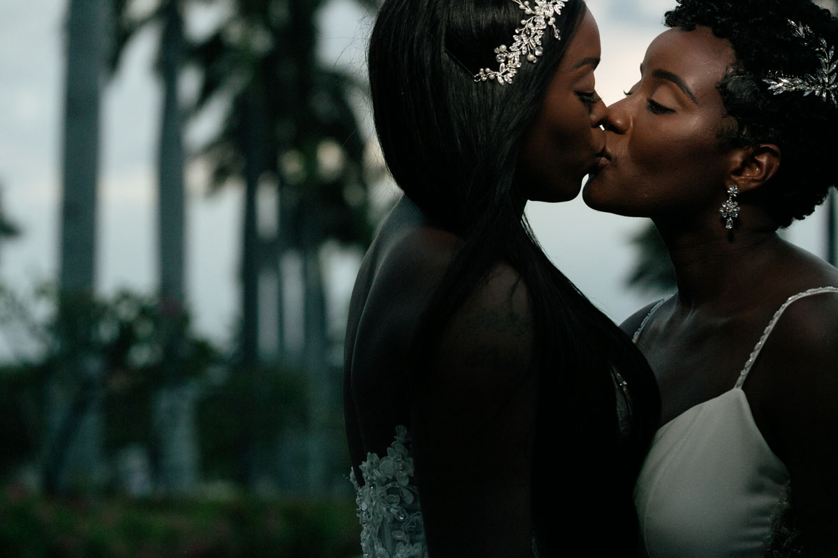 NewlywedsKissByWaterFeature