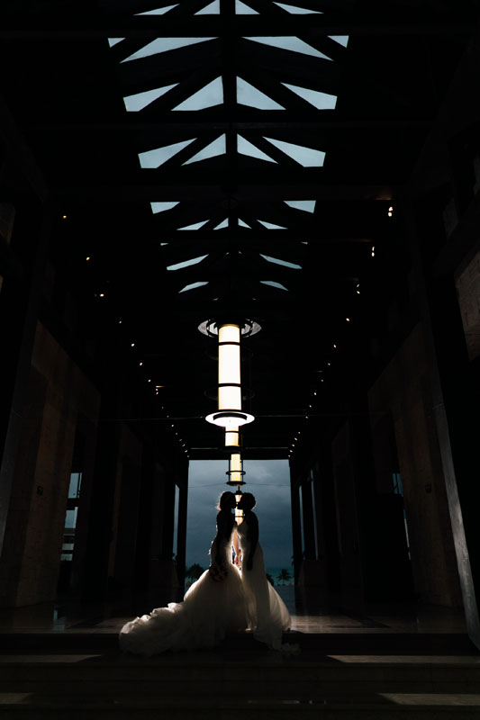 NewlywedsPoseInHallwayShilouette