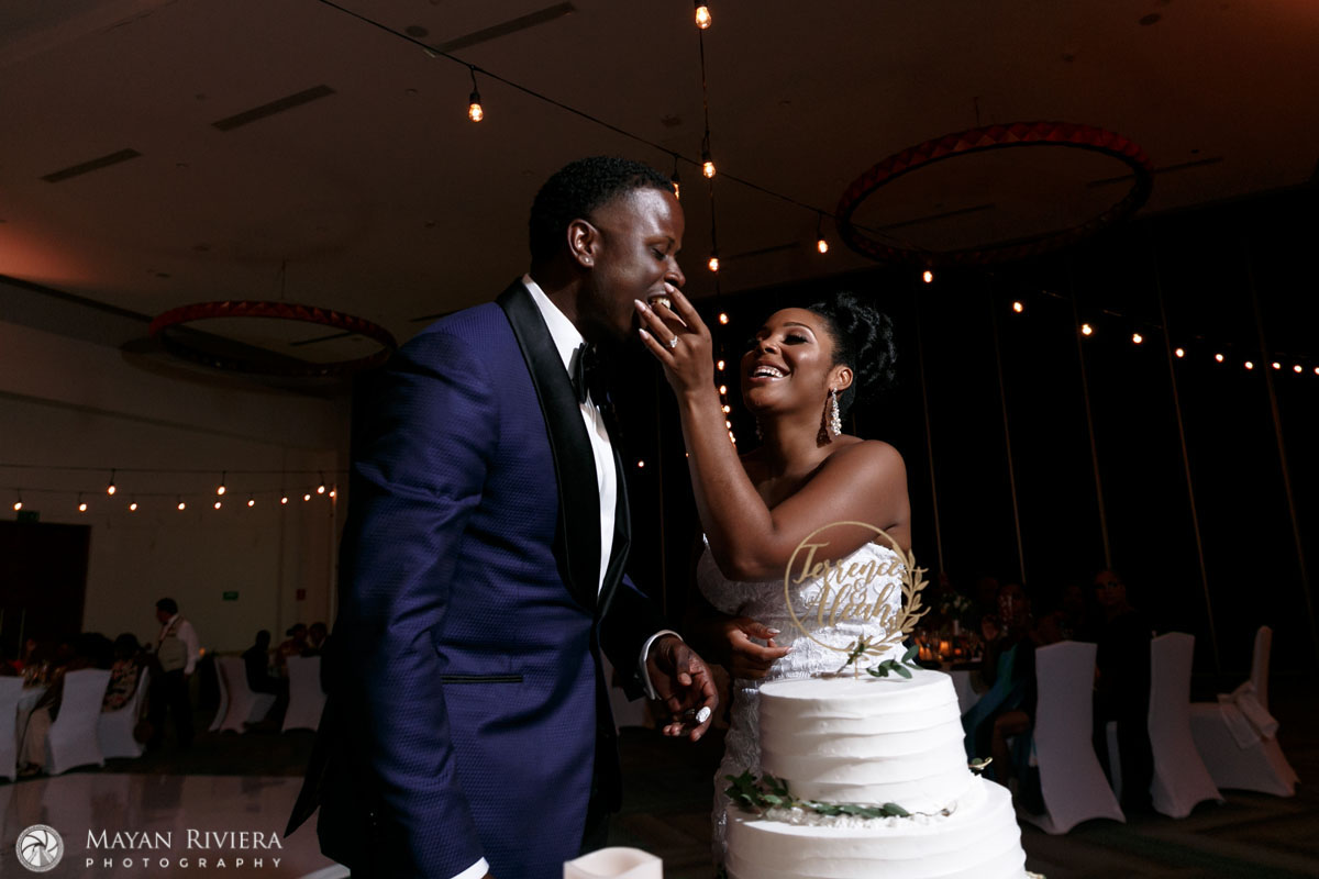 NewlywedsSharingWeddingCake