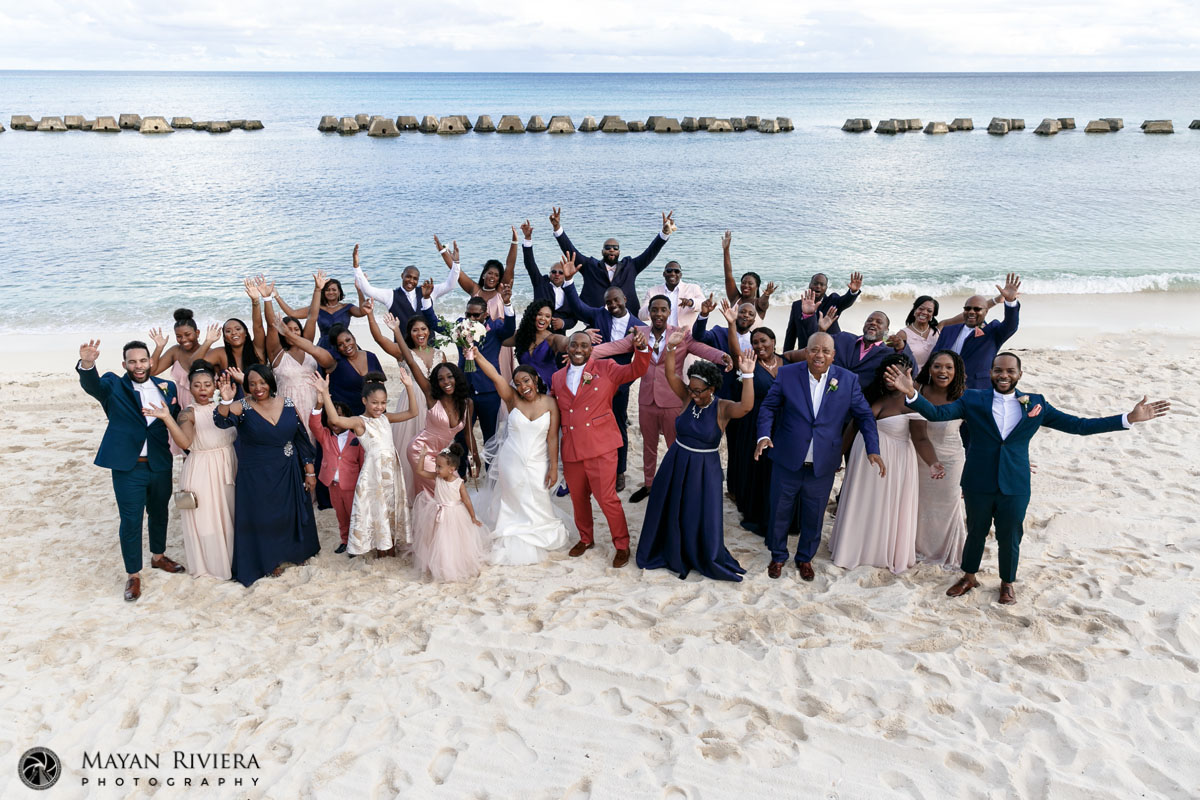 NewlywedsCheerWithGuestsInDroneShot