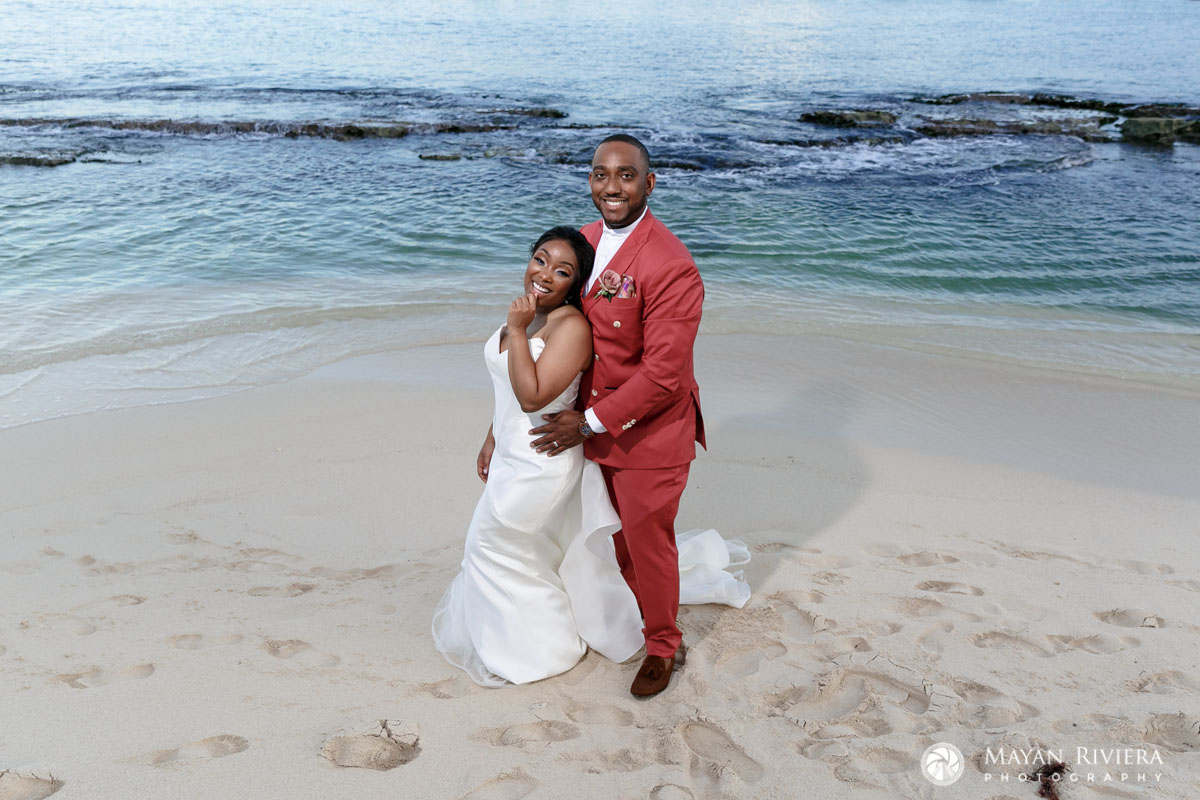 NewlywedsPoseOnBeachInDroneShot