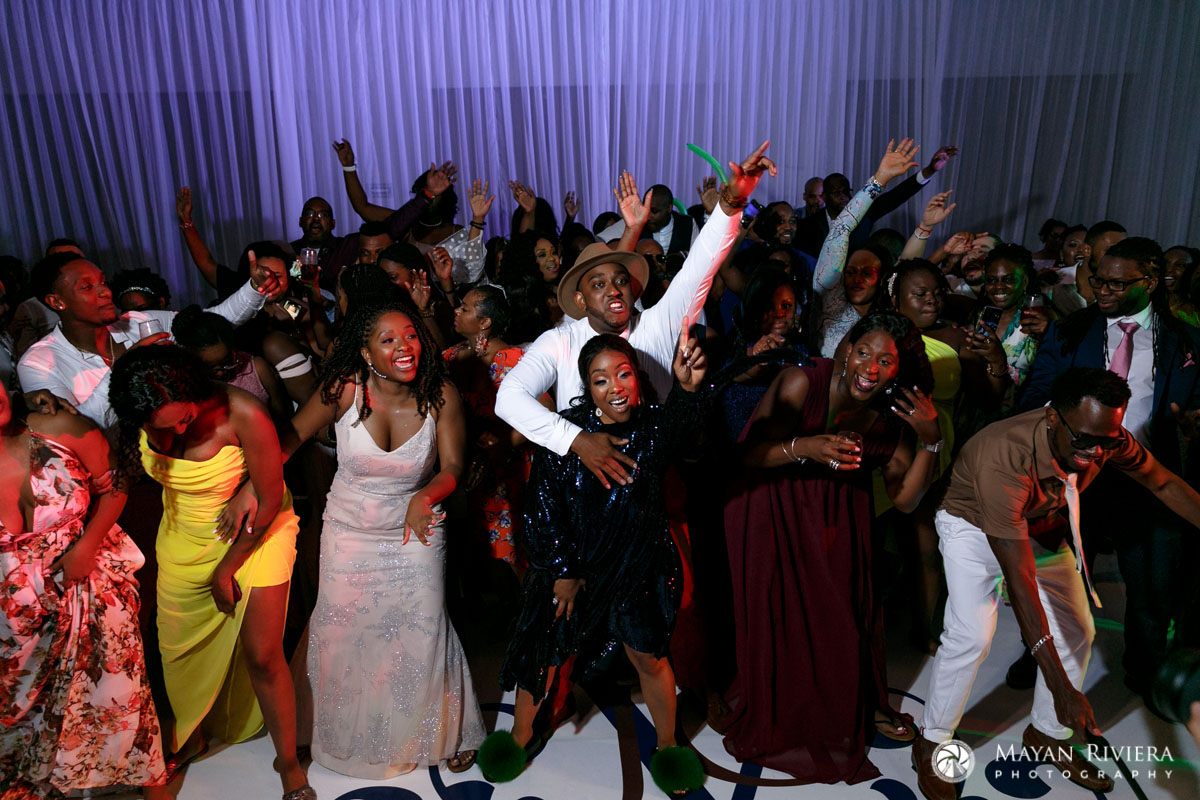 NewlywedsCheeringWithGuestsInDroneShot