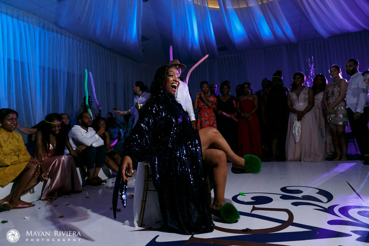 BrideCheersSittingInChairWearingSlippers