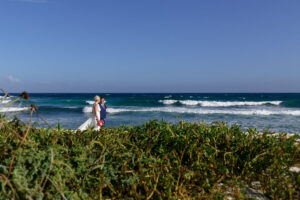 NewlywedsOnBeachStroll