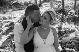 NewlywedsKissInJungle