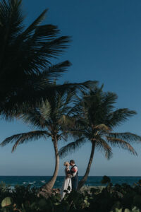 NewlywedsKissOnBeach