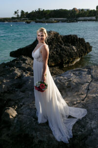 BridePosesOnBeachRocks