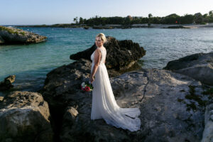 BridePosesOnBeachRocks