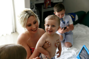 SmilingBrideMomHoldsSmilingBaby