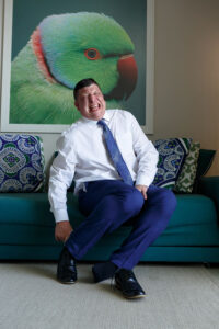 GroomGrimacesPuttingOnShoe