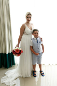 SmilingBrideWithArmAroundSon