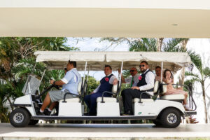 WeddingPartyRidesToCeremonyInGolfCart