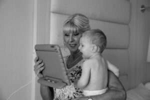 GrandmaSoothesCryingBabyWithiPad