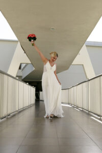 CheeringBrideLiftsBouquet