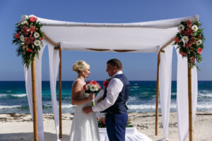 WeddingCoupleSmileAtEachOther