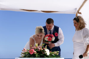 WeddingCoupleSignsMarriageCertificate