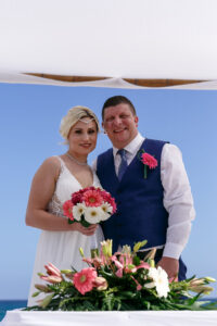 WeddingCoupleSimilesAfterSigningMarriageCertificate