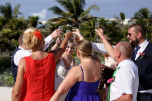 HoistingChampagneToToastNewlyweds