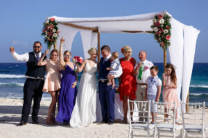 HoistingChampagneToToastNewlyweds