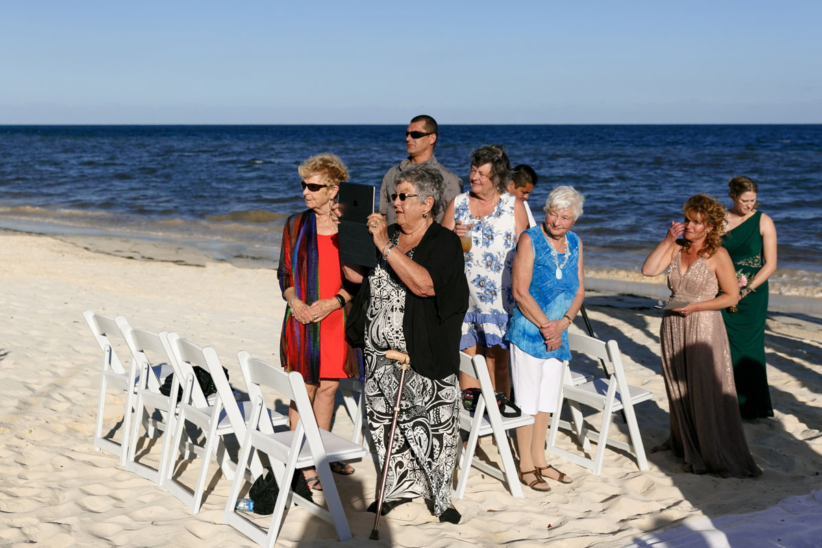 WeddingGuestsWatchForBridesArrival