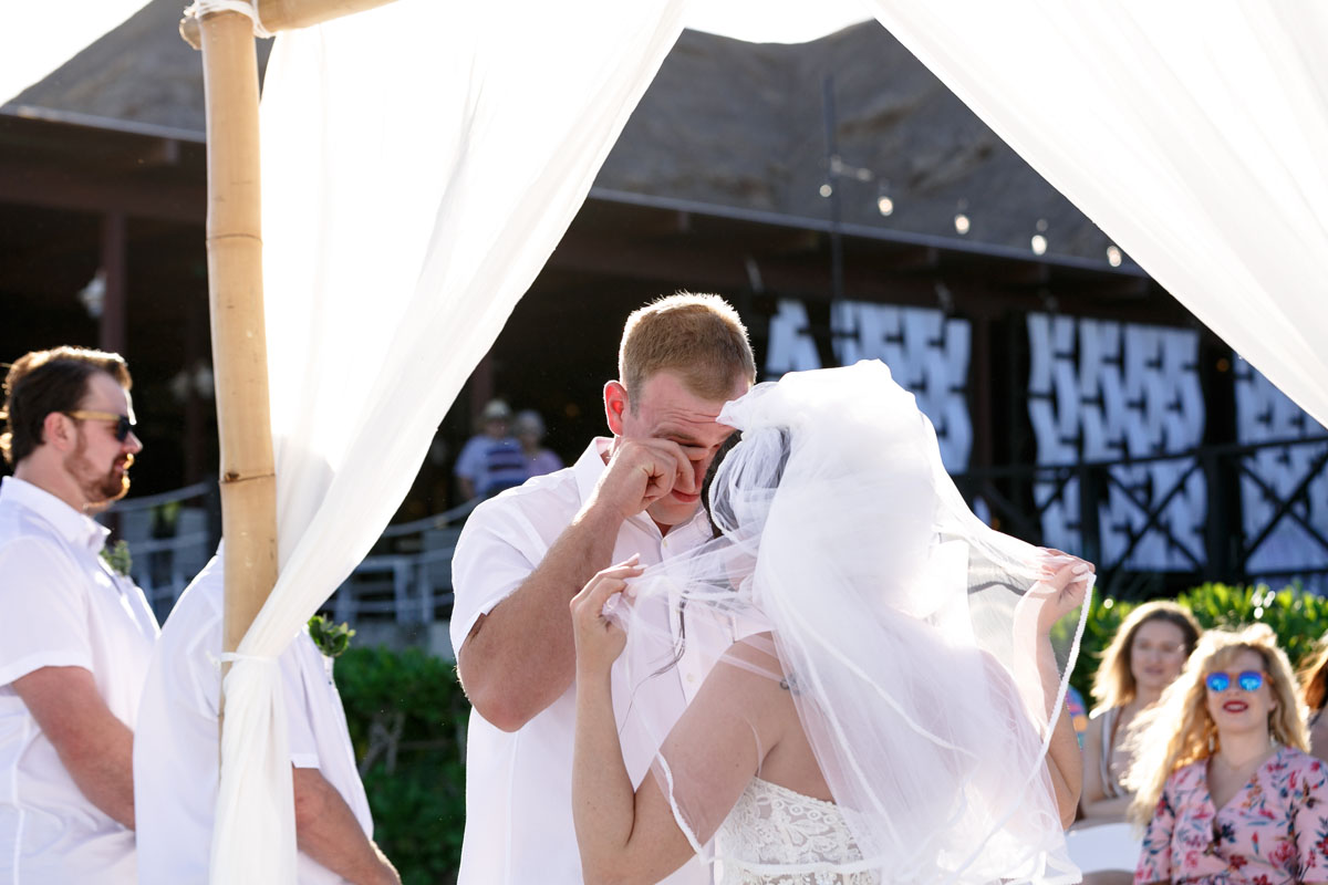 EmotionalGroomWipesHisEyes