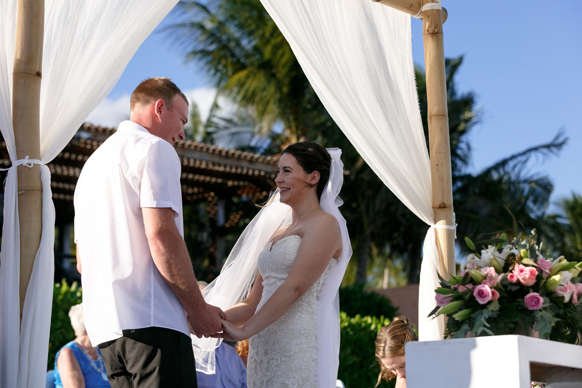 NowSapphireNewlywedsHoldHands