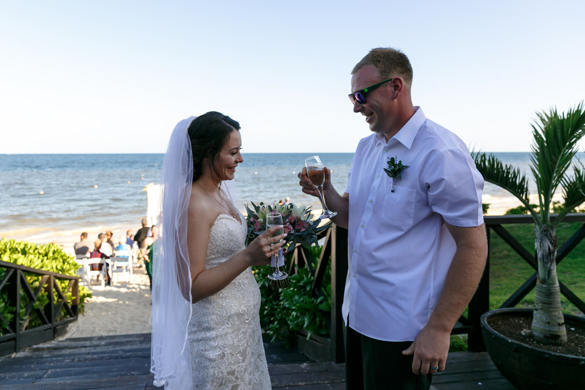 NowSapphireNewlywedsToastEachOther