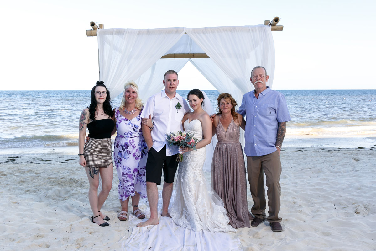 NewlywedsPoseWithFamily