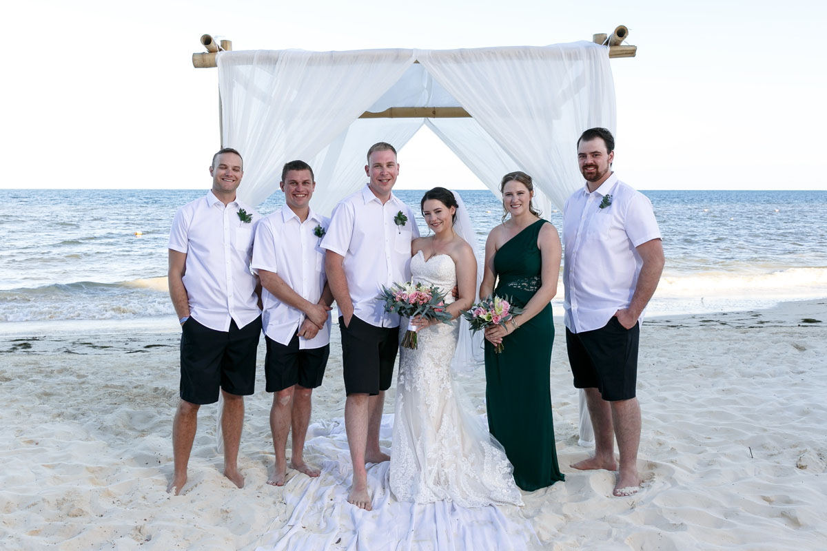 NewlywedsPoseWithWeddingParty