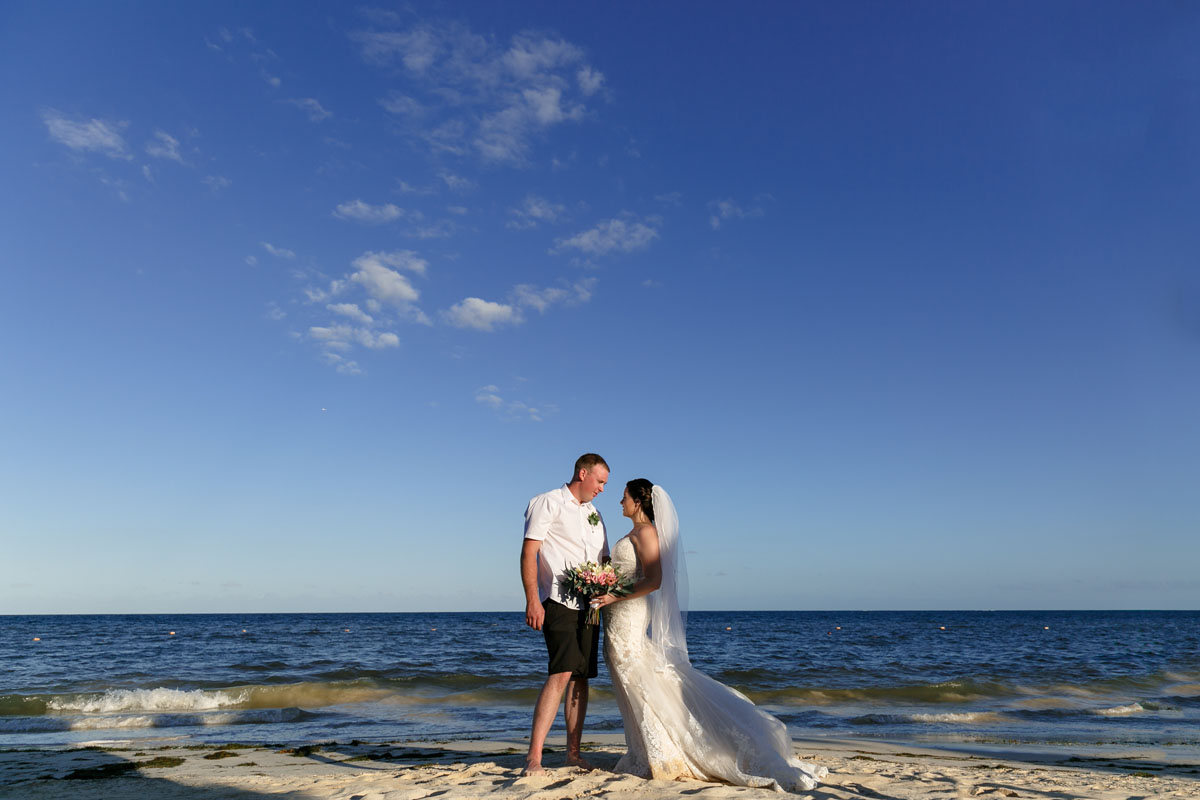 NewlywedsPoseOnBeach